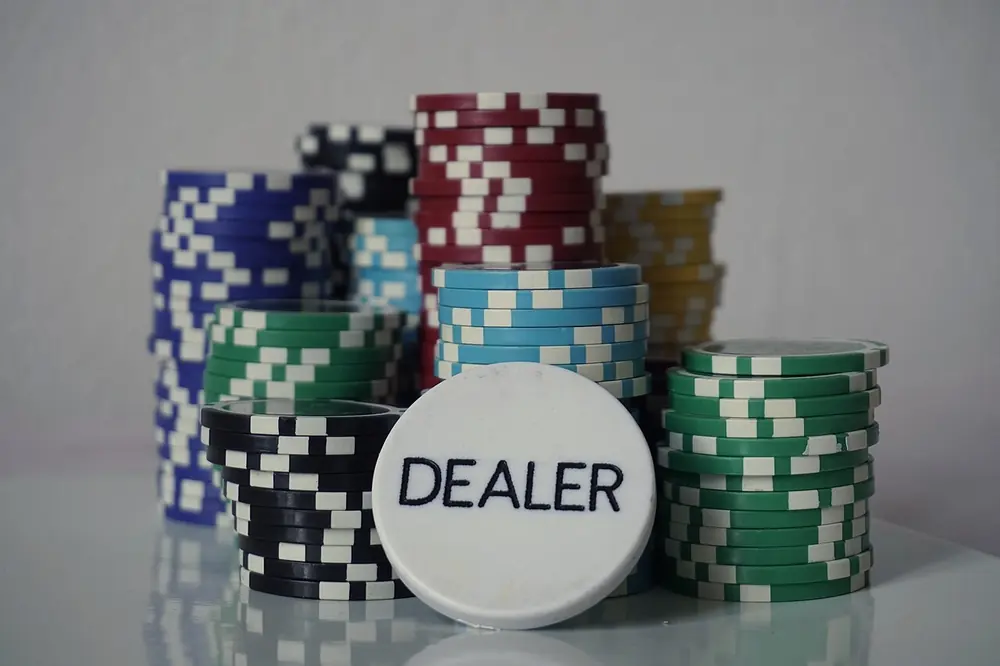 Poker chips and a dealer button - crypto casino vip program ireland