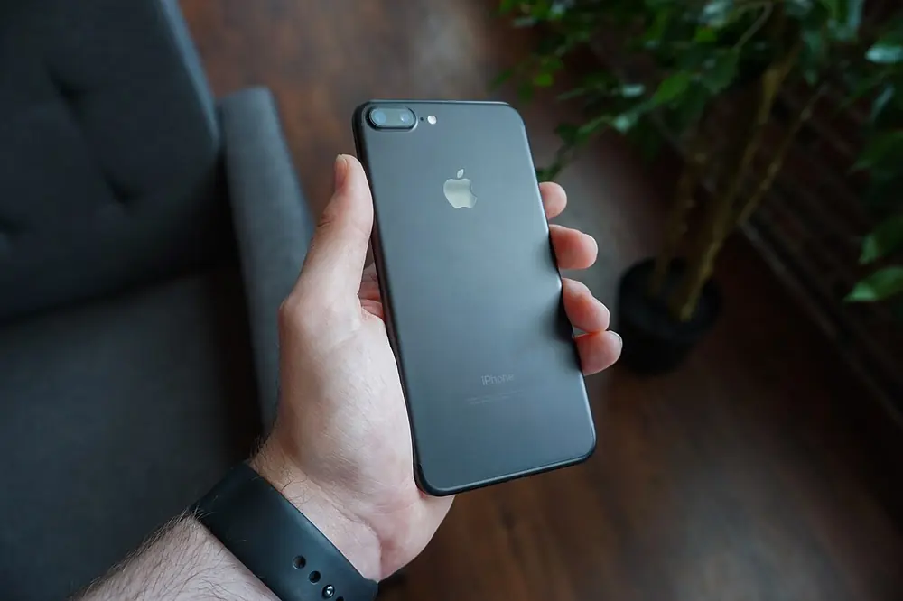 black smartphone in hand