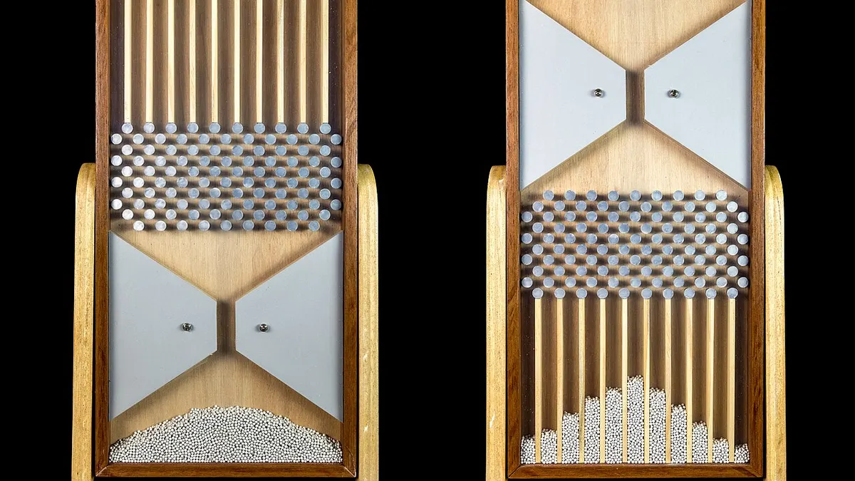 plinko crypto casino ireland - two wooden Galton boards (pegboards) with steel balls