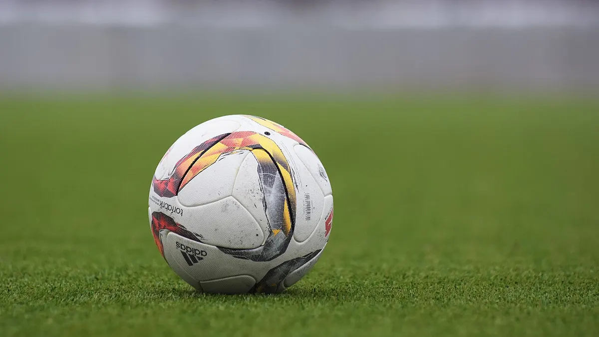Football on a pitch - irish horse racing betting scandal